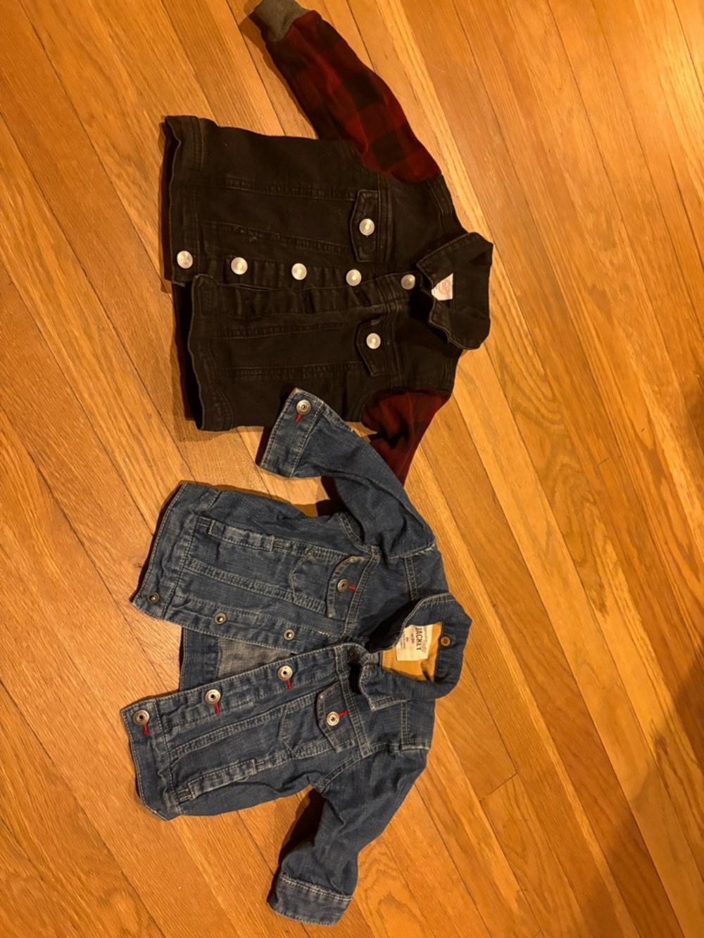 2 baby Denim Jackets 1 blue and 1 black with Red Plaid Sleeves